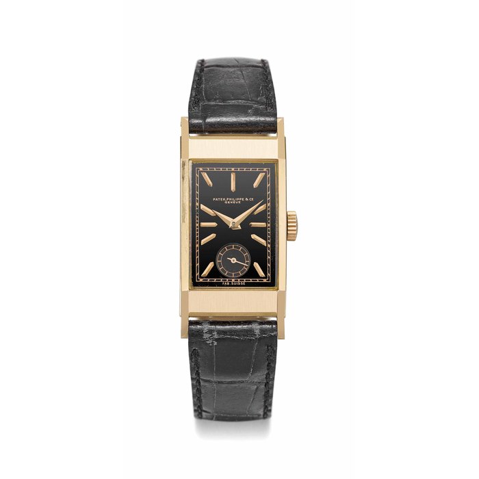 Patek Philippe. A fine and rare 18K pink gold rectangular curved wristwatch with black dial and original pink gold buckle and box Signed Patek Philippe & Co., Genève, ref. 425, movement no. 833'633, case no. 619'949, manufactured in 1940