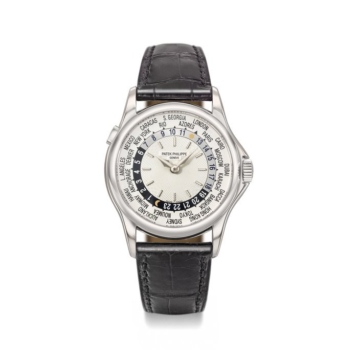 Patek Philippe. A fine 18k white gold automatic world time wristwatch with original certificate and box Signed Patek Philippe, Genève, Ref. 5110G-001, Movement No. 3’208’212, Case No. 4’142’214, Circa 2002