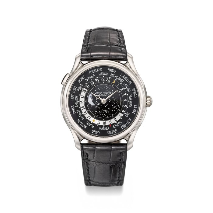 Patek Philippe. A very fine and rare 18K white gold limited edition automatic world time wristwatch with moon phases, certificate of origin, attestation, commemorative medal, setting pin, sale tag and box, made to commemorate the 175th anniversary of Patek Philippe in 2014 Signed Patek Philippe, Genève, 175th Anniversary 1839-2014, World Time Moon, ref. 5575G-001, movement no. 5’940’949, case no. 6’083’337, circa 2016
