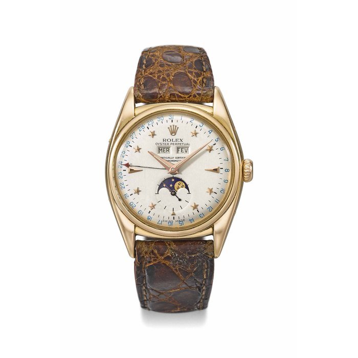 Rolex Rolex. A very rare and important 18K pink gold automatic triple calendar wristwatch with moon phases and star dial, service certificate, setting pin and box Signed Rolex, Oyster Perpetual, Officially certified chronometer, Ref. 6062, Case No. 788X2X, Circa 1952 · 6062