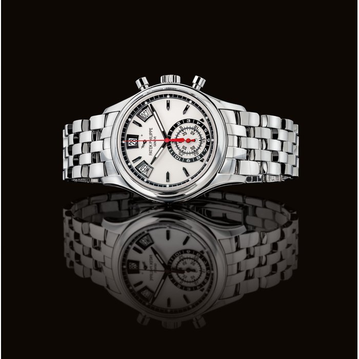 PATEK PHILIPPE. A FINE STAINLESS STEEL AUTOMATIC ANNUAL CALENDAR CHRONOGRAPH WRISTWATCH WITH DAY AND NIGHT INDICATION, POWER RESERVE AND BRACELET SIGNED PATEK PHILIPPE, GENEVE, REF. 5960, MOVEMENT NO. 5'825'325, CASE NO. 6'044'624, CIRCA 2015
