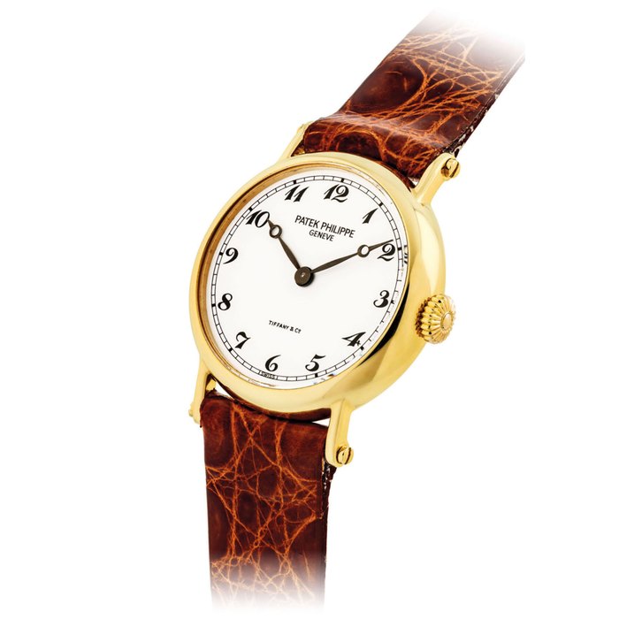 PATEK PHILIPPE. A LADY'S FINE AND RARE 18K GOLD WRISTWATCH WITH BREGUET NUMERALS SIGNED PATEK PHILIPPE, GENEVE, RETAILED BY TIFFANY & CO., REF. 4860, MOVEMENT NO. 1'415'287, CASE NO. 2'919'691, MANUFACTURED IN 1992