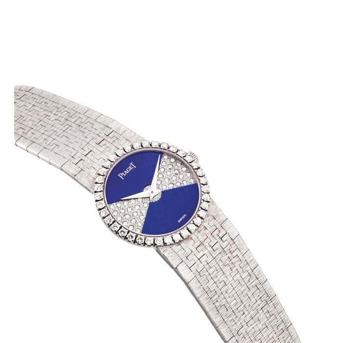PIAGET. A LADY’S 18K WHITE GOLD AND DIAMOND-SET BRACELET WATCH WITH LAPIS LAZULI DIAL SIGNED PIAGET, REF. 9706 A6, CASE NO. 335'263, CIRCA 1985