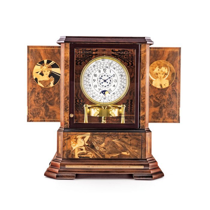 Jaeger-Lecoultre JAEGER-LECOULTRE. AN EXCEPTIONAL AND VERY RARE WOOD, GILT BRASS AND GLASS LIMITED EDITION ART NOUVEAU STYLE ATMOS CLOCK WITH 1000 YEAR CALENDAR AND MOON PHASES WITH WOOD MARQUETRY PANELS BY PHILIPPE MONTI AND JÉRÔME BOUTTEÇON SIGNED JAEGER-LECOULTRE, ATMOS MODEL, CASE SIGNED PHILIPPE MONTI AND JEROME BOUTTECON, NO. 30/50, MOVEMENT NO. 706'521, CIRCA 2000