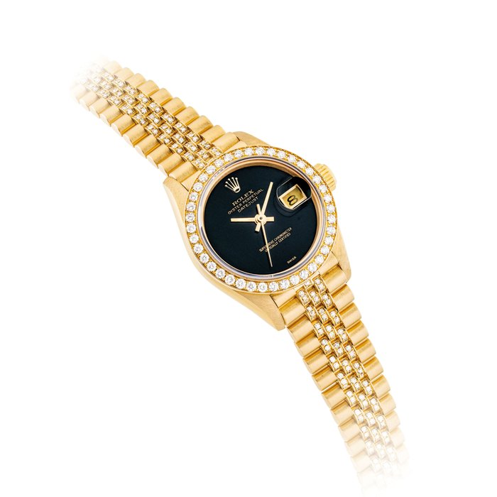 ROLEX. A LADY'S 18K GOLD AND DIAMOND-SET AUTOMATIC WRISTWATCH WITH SWEEP CENTRE SECONDS, DATE, BRACELET AND ONYX DIAL SIGNED ROLEX, OYSTER PERPETUAL, DATEJUST, REF. 69138, CASE NO. E363467, CIRCA 1990