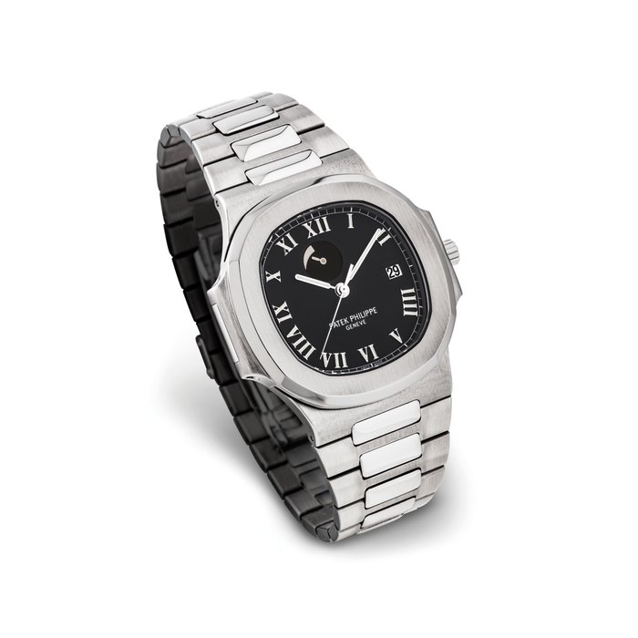 PATEK PHILIPPE. A FINE STAINLESS STEEL AUTOMATIC WRISTWATCH WITH SWEEP CENTRE SECONDS, DATE, POWER RESERVE AND BRACELET SIGNED PATEK PHILIPPE, GENEVE, NAUTILUS MODEL, REF. 3710, MOVEMENT NO. 3’148’794, CASE NO. 4’080’399, MANUFACTURED IN 2000