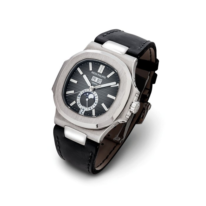 PATEK PHILIPPE. A FINE STAINLESS STEEL AUTOMATIC ANNUAL CALENDAR WRISTWATCH WITH SWEEP CENTRE SECONDS, MOON PHASES AND 24 HOUR INDICATION SIGNED PATEK PHILIPPE, GENEVE, NAUTILUS MODEL, REF. 5726, MOVEMENT NO. 5'774'374, CASE NO. 4'666'545, CIRCA 2015