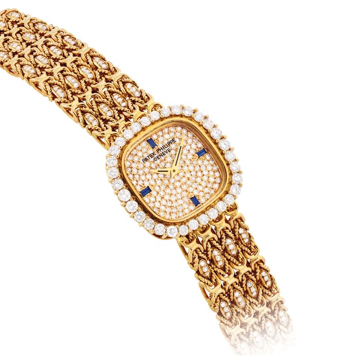 PATEK PHILIPPE. A LADY'S FINE 18K GOLD, DIAMOND AND SAPPHIRE-SET CUSHION-SHAPED BRACELET WATCH SIGNED PATEK PHILIPPE, GENEVE, REF. 4524, MOVEMENT NO. 1'394'913, CASE NO. 2'808'280, MANUFACTURED IN 1978