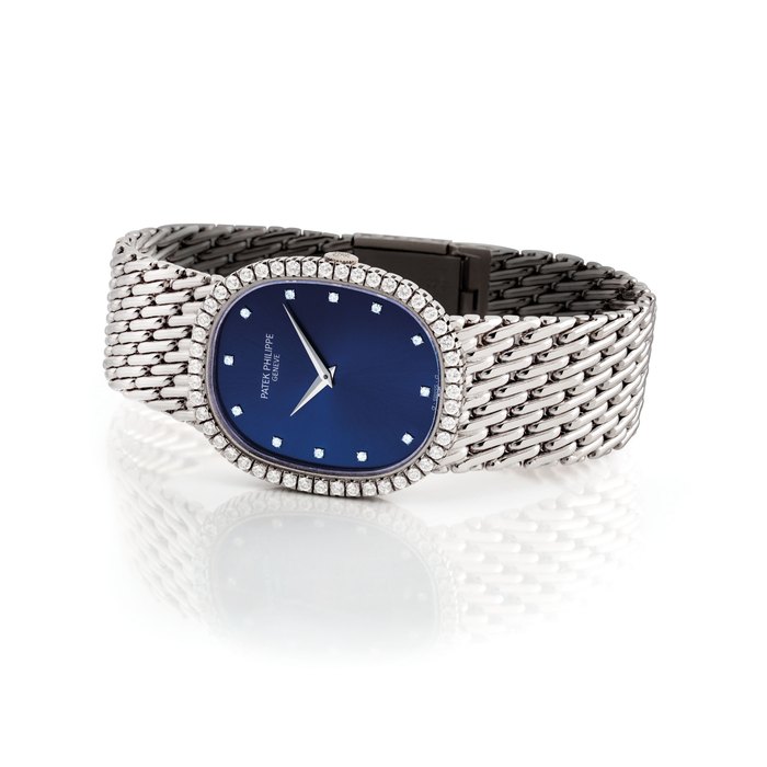 PATEK PHILIPPE. A FINE 18K WHITE GOLD AND DIAMOND-SET OVAL-SHAPED BRACELET WATCH SIGNED PATEK PHILIPPE, GENEVE, ELLIPSE MODEL, REF. 3748/91, MOVEMENT NO. 1'338'580, CASE NO. 2'871'497, MANUFACTURED IN 1990