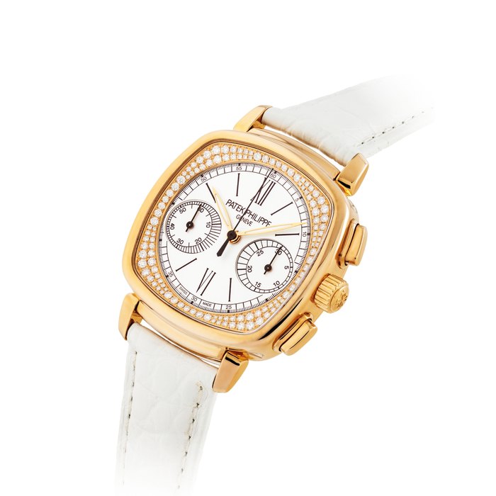 PATEK PHILIPPE. A LADY’S FINE AND ELEGANT 18K PINK GOLD AND DIAMOND-SET CUSHION-SHAPED CHRONOGRAPH WRISTWATCH SIGNED PATEK PHILIPPE, GENEVE, REF. 7071, MOVEMENT NO. 5’599’627, CASE NO. 4’751’180, MANUFACTURED IN 2011