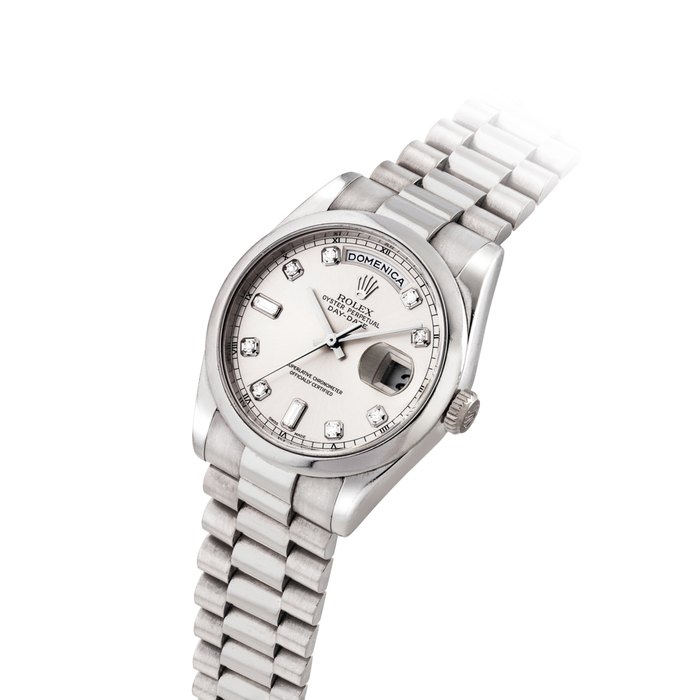 ROLEX. A FINE 18K WHITE GOLD AND DIAMOND-SET AUTOMATIC WRISTWATCH WITH SWEEP CENTRE SECONDS, DAY, DATE, BRACELET AND ITALIAN CALENDAR SIGNED ROLEX, OYSTER PERPETUAL, DAY-DATE MODEL, REF. 118209, CASE NO. P691263, CIRCA 2001