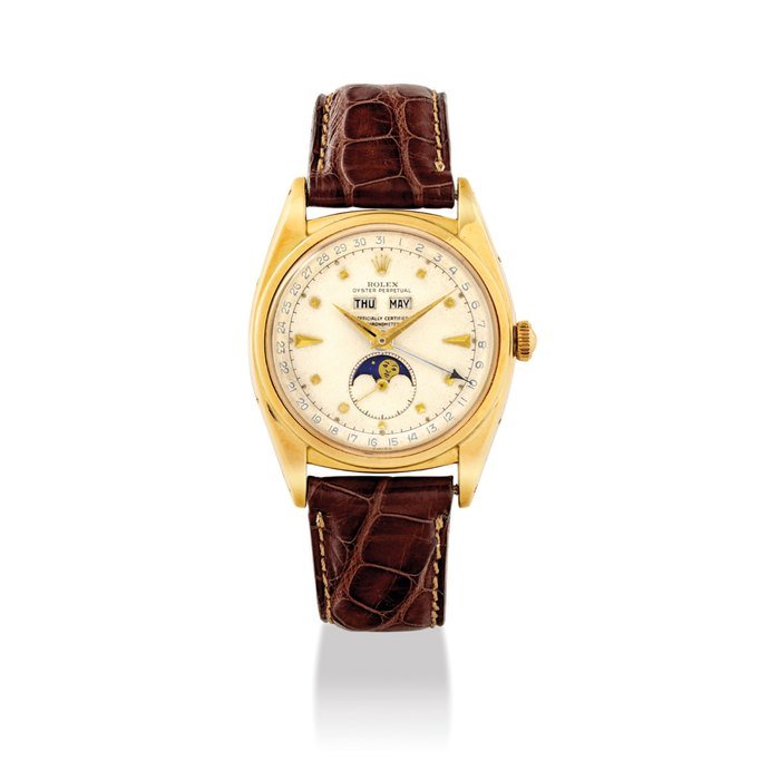 Rolex ROLEX. A VERY RARE AND ATTRACTIVE 18K GOLD AUTOMATIC TRIPLE CALENDAR WRISTWATCH WITH MOON PHASES AND “PYRAMID” DIAL SIGNED ROLEX, OYSTER PERPETUAL, OFFICIALLY CERTIFIED CHRONOMETER, REF. 6062, CASE NO.9*2'52*, CIRCA 1953 · 6062