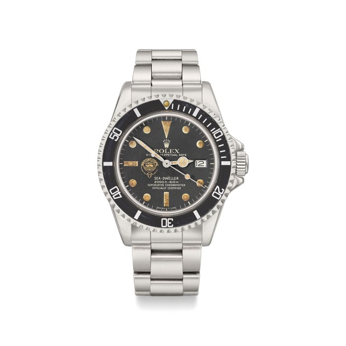 Rolex. An extremely fine and very rare stainless steel automatic wristwatch with sweep centre seconds, date, bracelet, Guarantee and box, made for Kuwait Signed Rolex, Oyster Perpetual Date, Sea-Dweller, 2000ft = 610m, Superlative chronometer, officially certified, Ref. 1665, Case No. 5’697’263, circa 1978