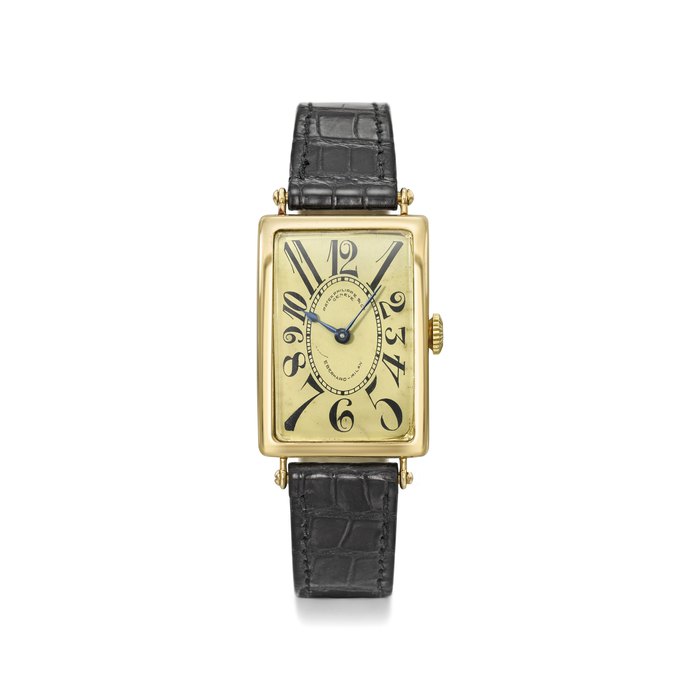 PATEK PHILIPPE. A RARE AND EARLY 18K GOLD RECTANGULAR CURVED HINGED WRISTWATCH WITH GILT DIAL AND “EXPLOSION” NUMERALS SIGNED PATEK PHILIPPE & CO, GENEVE, RETAILED BY EBERHARD MILAN, REF. 10, MOVEMENT NO. 192’464, CASE NO. 287’540, MANUFACTURED IN 1919