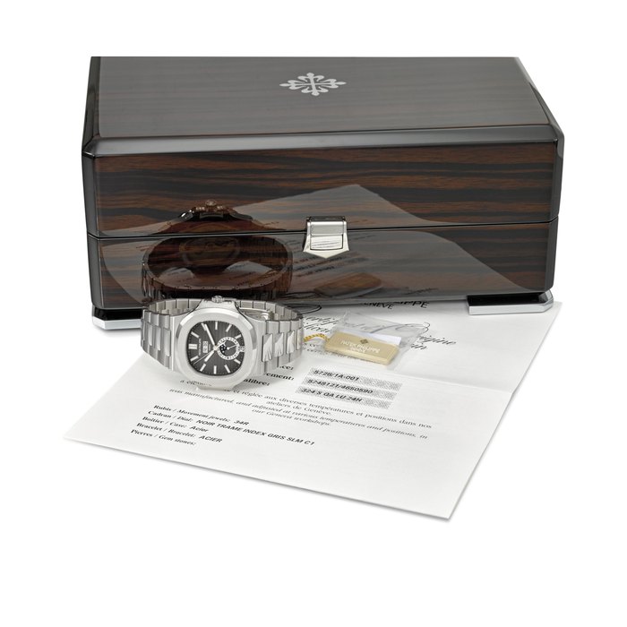PATEK PHILIPPE. A VERY FINE AND RARE STAINLESS STEEL AUTOMATIC ANNUAL CALENDAR WRISTWATCH WITH SWEEP CENTRE SECONDS, MOON PHASES, 24 HOUR INDICATION, ORIGINAL CERTIFICATE AND BOX SIGNED PATEK PHILIPPE, GENEVE, NAUTILUS MODEL, REF. 5726/1A-001, MOVEMENT NO. 5’748’121, CASE NO. 4’650’590, CIRCA 2013