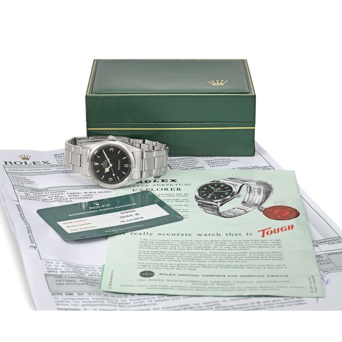 Rolex. A fine and rare stainless steel automatic wristwatch with sweep centre seconds, black lacquer dial, service guarantee, invoice, brochure and box Signed Rolex, Oyster Perpetual, Explorer, ref. 1016, case no. 516’584, circa 1960