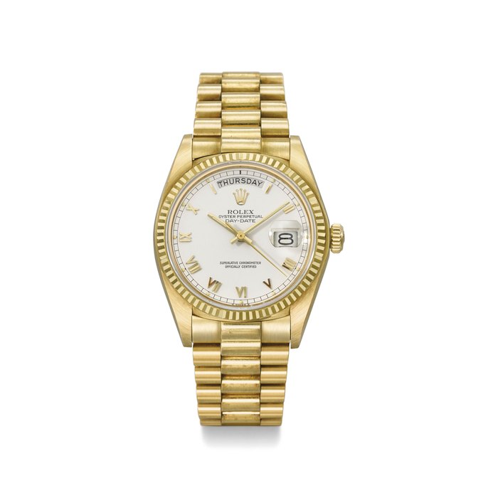 Rolex. A fine and rare 18K gold automatic wristwatch with sweep centre seconds, day, date and bracelet Signed Rolex, Oyster Perpetual, Day-Date, Ref. 18038, Case No. 6’607’203, Circa 1981