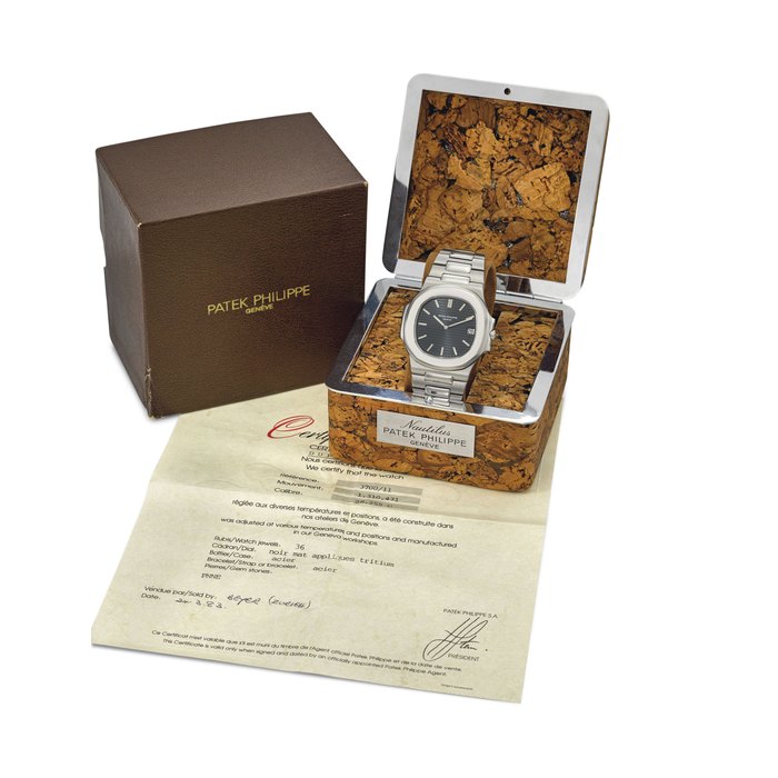 Patek Philippe. A fine and very rare stainless steel automatic wristwatch with date, bracelet, certificate and Nautilus cork box Signed Patek Philippe, Genève, Nautilus model, ref. 3700/11, movement no. 1’310’431, case no. 541’054, circa 1983