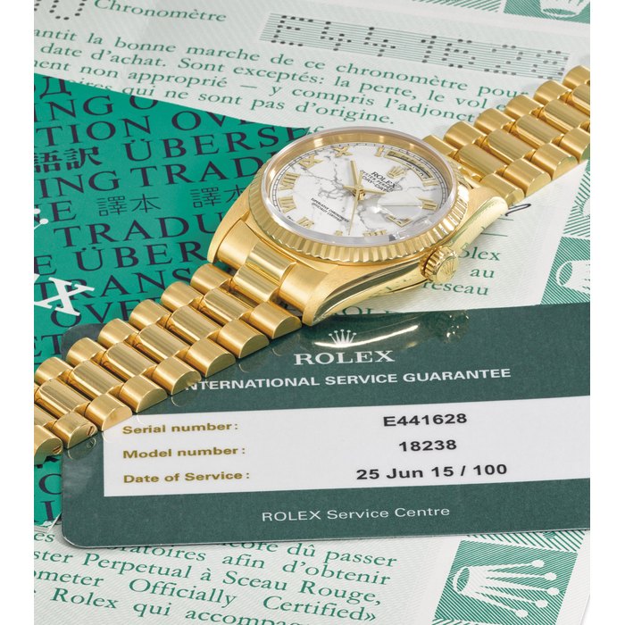 Rolex. A very fine and rare 18K gold automatic wristwatch with sweep centre seconds, day, date, marble dial, bracelet, guarantee and box Signed Rolex, Oyster Perpetual, Day-Date, ref. 18238, case no. E441628, circa 1990