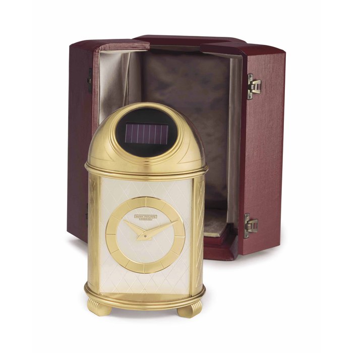 Patek Philippe. A Fine and Very Rare Gilt Brass Solar-Powered Dome Table Clock with Fitted Box Signed Patek Philippe, Genève, Ref. 701, Movement No. 872'777, Case No. 70'101, Manufactured in 1956