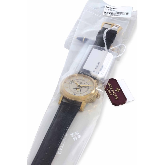 Patek Philippe. A Very Rare 18k Gold Limited Edition Automatic Annual Calendar Wristwatch with Moon Phases and Center Seconds Signed Patek Philippe, Genève, Retailed by Tiffany & Co., Ref. 5150J, Movement No. 3'235'299, Case No. 4'162'240, Manufactured in 2001