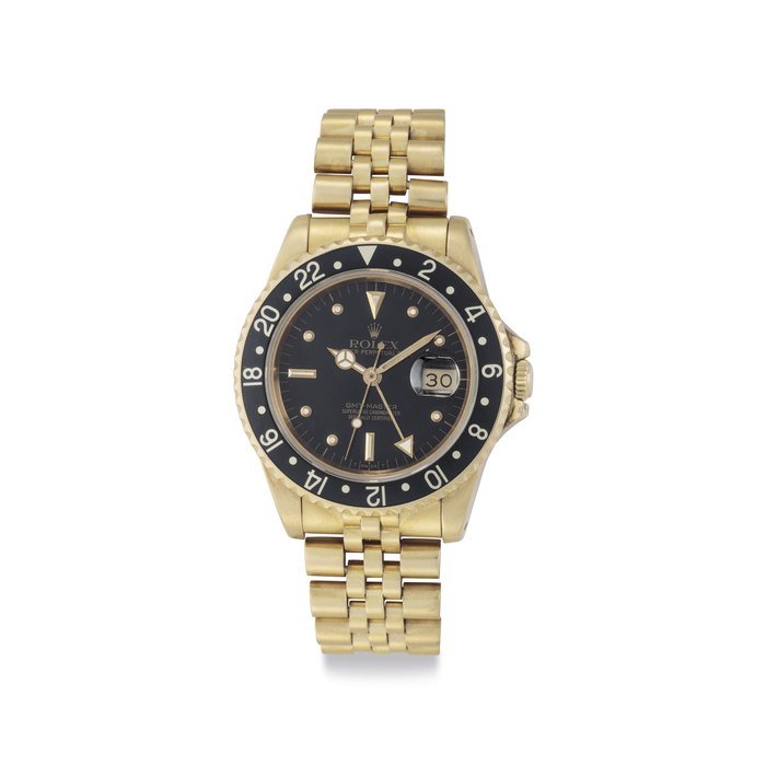Rolex Rolex. A Fine 18k Gold Dual Time Automatic Wristwatch with Date, Center Seconds and Bracelet Signed Rolex, Oyster Perpetual Date, GMT-Master, Ref. 16758, Case no. 8'899'988, Circa 1986 · 16758