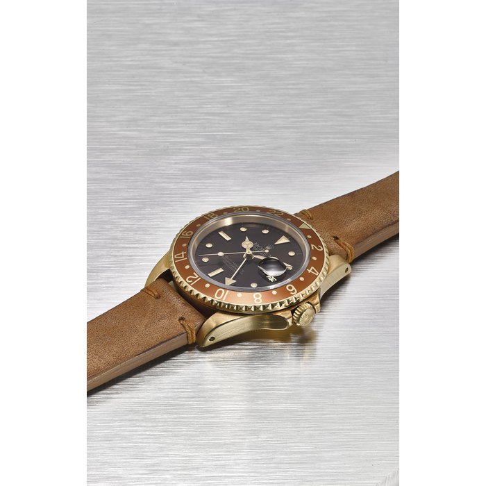 Rolex ROLEX. A VERY FINE AND RARE 18K GOLD DUAL TIME AUTOMATIC WRISTWATCH WITH SWEEP CENTRE SECONDS, DATE, ORIGINAL WARRANTY AND BOX SIGNED ROLEX, OYSTER PERPETUAL DATE, GENEVE, GMT-MASTER, SUPERLATIVE CHRONOMETER OFFICIALLY CERTIFIED, REF. 16758, CASE NO. 6’581’980, CIRCA 1984 · 16758