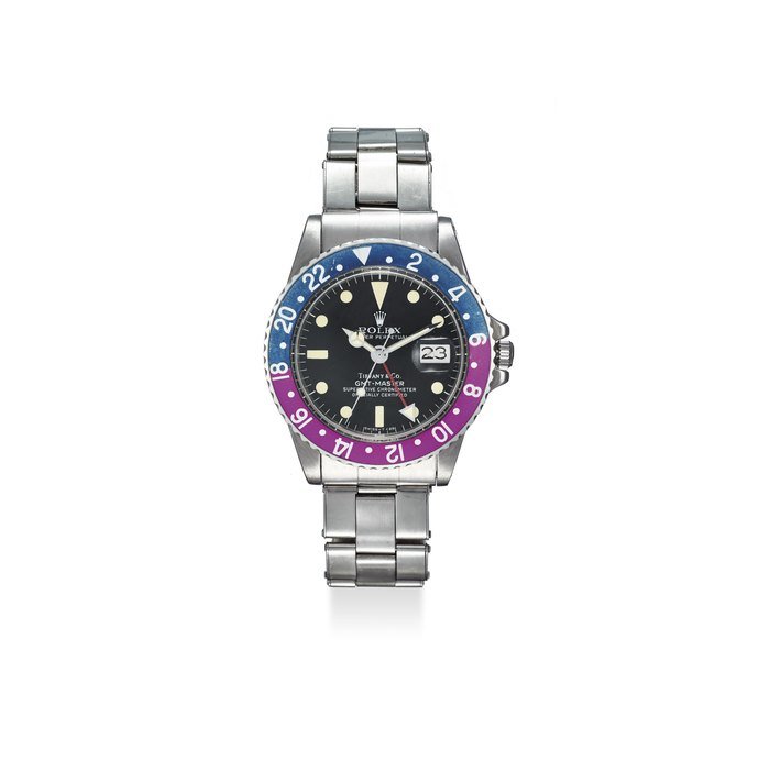 Rolex ROLEX. A VERY FINE AND RARE, STAINLESS STEEL AUTOMATIC DUAL TIME WRISTWATCH WITH SWEEP CENTRE SECONDS, 24 HOUR BEZEL, DATE, AND BRACELET SIGNED TIFFANY & CO SIGNED ROLEX, RETAILED BY TIFFANY & CO., OYSTER PERPETUAL DATE, GMT-MASTER, SUPERLATIVE CHRONOMETER OFFICIALLY CERTIFIED, REF. 1675, CASE NO. 5’659’667, CIRCA 1978 · 1675