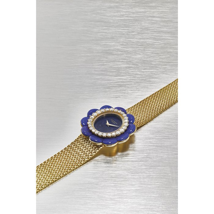 Patek Philippe PATEK PHILIPPE. A VERY RARE, UNUSUAL AND ELEGANT 18K YELLOW GOLD, LAPIS LAZULI AND DIAMOND-SET WRISTWATCH IN THE FORM OF A FLOWER FACE WITH BRACELET AND EXTRACT FROM THE ARCHIEVE SIGNED PATEK PHILIPPE, GENÈVE, REF. 4322/1, MOVEMENT NO. 1’274’895, CASE NO.2’760’143, MANUFACTURED IN 1976, Price & Market Data