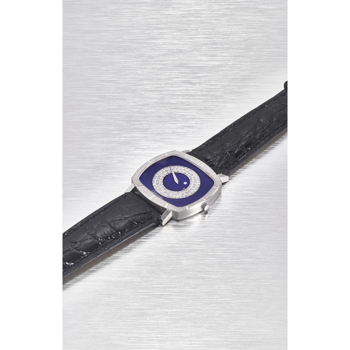 PIAGET. A FINE 18K WHITE GOLD AND DIAMOND-SET AUTOMATIC CUSHION-SHAPED WRISTWATCH WITH LAPIS LAZULI DIAL AND DIAMOND DIAL SIGNED PIAGET, REF. 12721, MOVEMENT NO. 1’911’469 CASE NO. 244’713, MANUFACTURED IN 1980