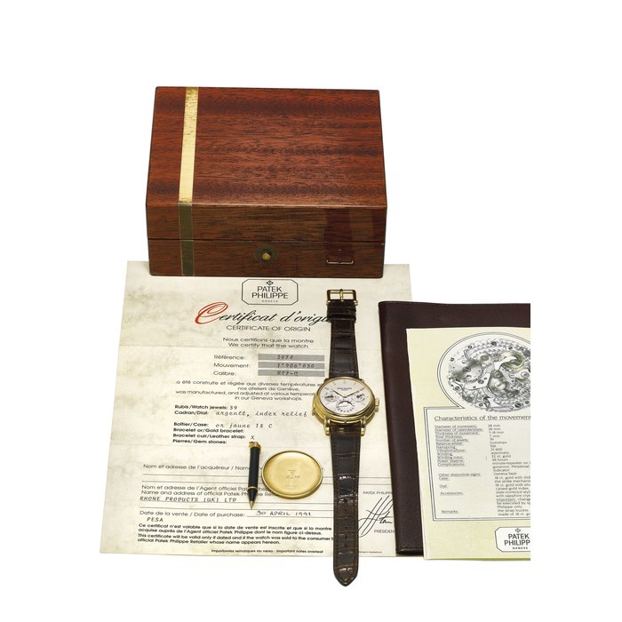 PATEK PHILIPPE. A VERY FINE AND RARE 18K YELLOW GOLD AUTOMATIC MINUTE REPEATING PERPETUAL CALENDAR WRISTWATCH WITH MOON PHASES, ORIGINAL CERTIFICATE, SECOND CASE BACK AND BOX SIGNED PATEK PHILIPPE, GENÈVE, REF. 3974, MOVEMENT NO. 1'906'030, CASE NO. 2'867'127, MANUFACTURED IN 1991