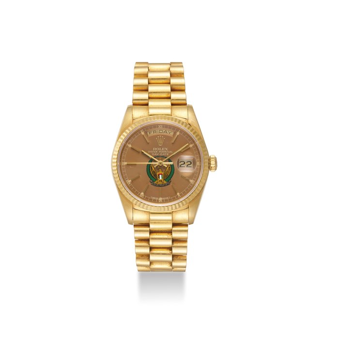 ROLEX. A FINE 18K GOLD AUTOMATIC WRISTWATCH WITH SWEEP CENTRE SECONDS, DAY, DATE AND BRACELET, “UAE ARMED FORCES EAGLE” COAT OF ARMS SIGNED ROLEX, OYSTER PERPETUAL, DAY-DATE MODEL, REF. 18038/18000, CASE NO. R 310’738, CIRCA 1987