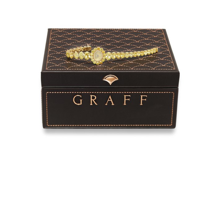 GRAFF. A MAGNIFICENT 18K GOLD AND FANCY VIVID YELLOW DIAMOND SET LADY’S QUARTZ WRISTWATCH WITH INTEGRAL FANCY VIVID YELLOW DIAMOND SET BRACELET AND BOX SIGNED GRAFF, CIRCA 2018