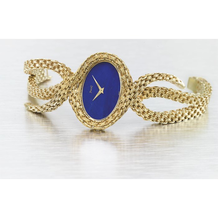PIAGET. A VERY FINE AND ELEGANT 18K GOLD AND LAPIS LAZULI BRACELET WATCH SIGNED PIAGET, REF. 9850 N 44, MOVEMENT 7’005’166 CASE NO. 193’295, MANUFACTURED IN 1970