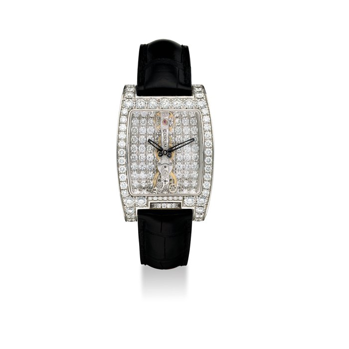 CORUM. A FINE AND LARGE 18K WHITE GOLD DIAMOND-SET, TONNEAU SHAPED SKELETONISED WRISTWATCH WITH LINEAR MOVEMENT AND WARRANTY CARD SIGNED CORUM, GOLDEN BRIDGE 40 HOUR POWER RESERVE, REF. 113.889.69, CASE NO. 17.43988, CIRCA 2013