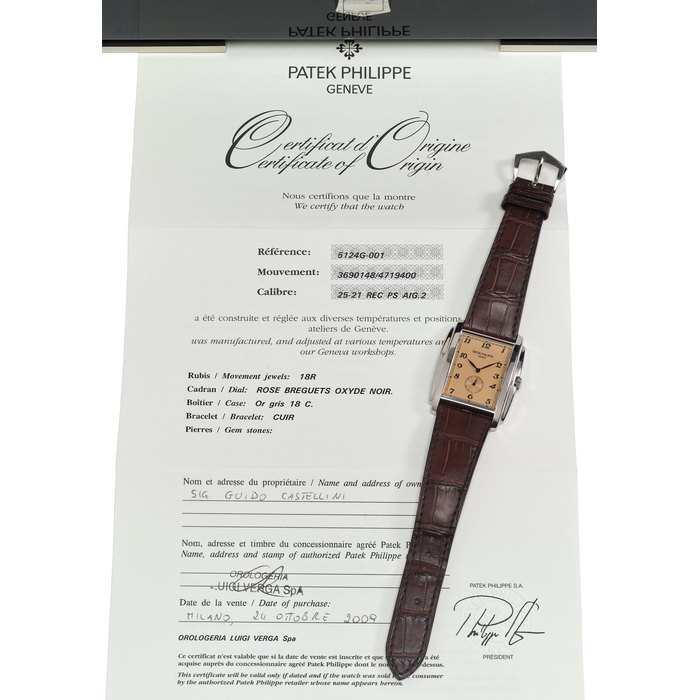 PATEK PHILIPPE. AN ATTRACTIVE AND FINE WHITE GOLD TONNEAU-SHAPED WRISTWATCH WITH ROSE DIAL, BREGUET NUMERALS, ORIGINAL CERTIFICATE AND BOX SIGNED PATEK PHILIPPE, GENEVE, GONDOLO MODEL, REF. 5124G, MOVEMENT NO. 3’690’148. CASE NO. 4’719’400, MANUFACTURED IN 2009