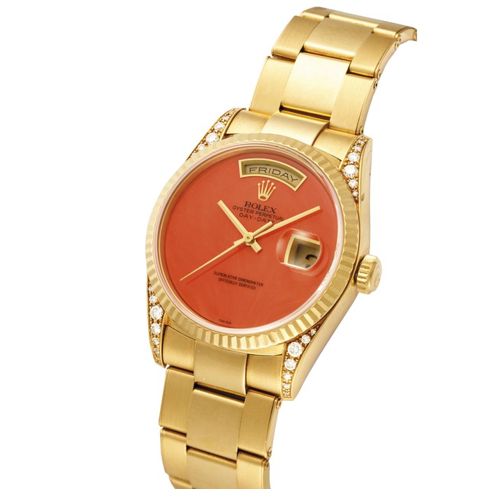 ROLEX. A VERY ATTRACTIVE AND RARE 18K GOLD AND DIAMOND-SET WRISTWATCH A WITH CORAL DIAL, SEEP CENTRE SECONDS, DAY, DATE, BRACELET AND ORIGINAL CERTIFICATE SIGNED ROLEX, OYSTER PERPETUAL, DAY-DATE, SUPERLATIVE CHRONOMETER, OFFICIALLY CERTIFIED, REF. 18338, CASE NO. W 008’743, CIRCA 1995
