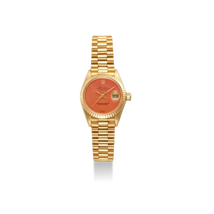 ROLEX. AN EXTREMELY FINE AND RARE 18K GOLD AUTOMATIC WRISTWATCH WITH A CORAL DIAL, SWEEP CENTRE SECONDS, DATE AND BRACELET SIGNED ROLEX, OYSTER PERPETUAL, DATEJUST, SUPERLATIVE CHRONOMETER, OFFICIALLY CERTIFIED, REF. 6917, CASE NO. 6’674’344, CIRCA 1981