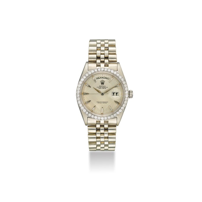 ROLEX. A VERY FINE AND EXTREMELY RARE PLATINUM DIAMOND-SET AUTOMATIC WRISTWATCH WITH SWEEP CENTRE SECONDS, LINEAR GEOMETRIC DIAL, ARABIC DAY AND DATE, BRACELET SIGNED ROLEX, REF. 1804, CASE NO. 808135, CIRCA 1962