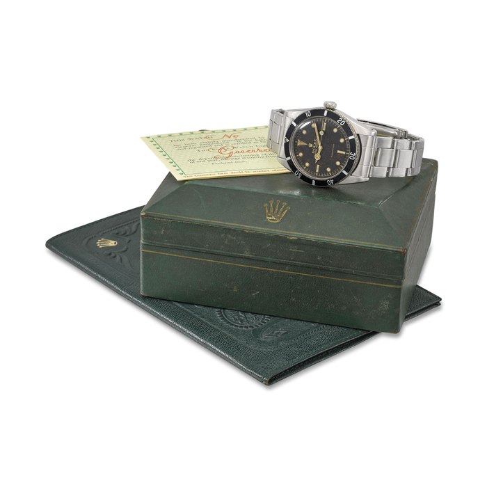 ROLEX. A RARE STAINLESS STEEL AUTOMATIC WRISTWATCH WITH SWEEP CENTRE SECONDS, BRACELET, BLANK GUARANTEE AND BOX Signed Rolex, Oyster Perpetual, Submariner model, ref. 6205, case no. 85’906, circa 1954