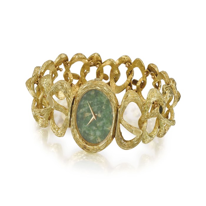 PIAGET. A VERY FINE AND ELEGANT LADY’S 18K GOLD BRACELET WATCH WITH JADE DIAL SIGNED PIAGET, ESCLAVE MODEL, REF. NO. 9850 D 71, MOVEMENT NO. 6’905’086, CASE NO. 177’332, MANUFACTURED IN 1969