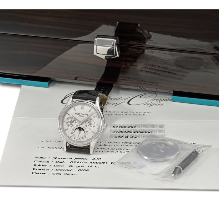 PATEK PHILIPPE. A FINE 18K WHITE GOLD AUTOMATIC PERPETUAL CALENDAR WRISTWATCH WITH MOON PHASES, ORIGINAL CERTIFICATE, ADDITIONAL SOLID CASE BACK AND BOX Signed Patek Philippe, Genève, ref. 5140G-001, movement no. 3’129’439, case no. 4’354’900, circa 2007