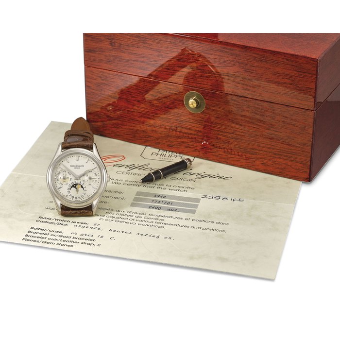 Patek Philippe. A fine and rare 18K white gold automatic perpetual calendar wristwatch with moon phases, original certificate, setting pin and box Signed Patek Philippe, Geneve, ref. 3940, movement no. 774’701, case no. 2’958’168, manufactured in 1994