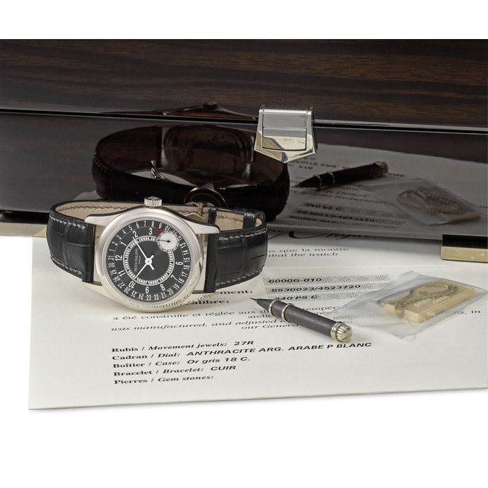 Patek Philippe. A fine and attractive 18K white gold automatic wristwatch with date, original certificate and box Signed Patek Philippe, Genève, Ref. 6000G-010, Movement No. 5’530’023, Case No. 4’523’720, Circa 2011