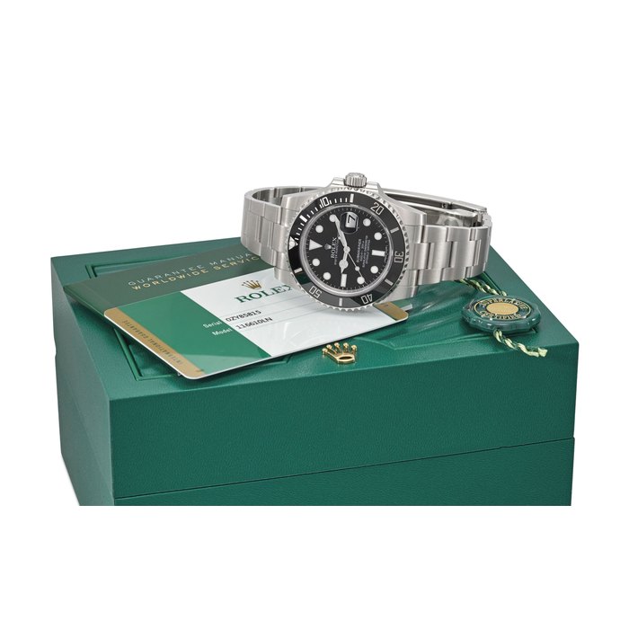 ROLEX. A STAINLESS STEEL AUTOMATIC WRISTWATCH WITH DATE, SWEEP CENTRE SECONDS, BRACELET, ORIGINAL GUARANTEE AND BOX SIGNED ROLEX, OYSTER PERPETUAL DATE, SUBMARINER, 1000FT = 300M, REF. 116610LN, CASE NO. OZY85815, CIRCA 2016