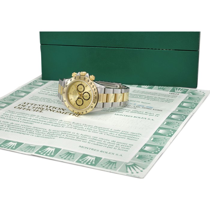 ROLEX. A FINE STAINLESS STEEL AND 18K GOLD AUTOMATIC CHRONOGRAPH WRISTWATCH WITH CHAMPAGNE DIAL, BRACELET AND BOX Signed Rolex, Oyster Perpetual, Cosmograph, Daytona, ref. 16523, case no. U132707, circa 1999