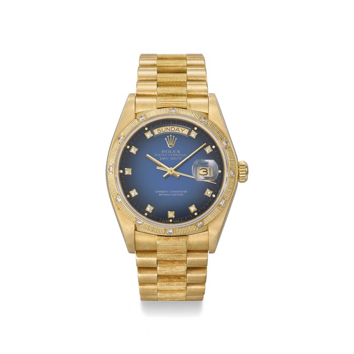 ROLEX. A RARE AND ATTRACTIVE 18K GOLD AND DIAMOND-SET AUTOMATIC WRISTWATCH WITH SWEEP CENTRE SECONDS, DAY, DATE, BLUE DEGRADE DIAL AND BRACELET SIGNED ROLEX, OYSTER PERPETUAL, DAY-DATE, REF. 18048, CASE NO.6’387’244, CIRCA 1980