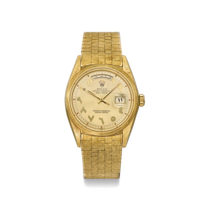 ROLEX. A VERY FINE AND RARE 18K GOLD AUTOMATIC WRISTWATCH WITH SWEEP CENTRE SECONDS, DAY, DATE, LINEN-TEXTURED BRACELET AND GILT DIAL WITH RELIEF ARABIC NUMERALS, MADE FOR THE EASTERN MARKET SIGNED ROLEX, OYSTER PERPETUAL, DAY-DATE, REF. 1806, CASE NO. 2'971'910, CIRCA 1972