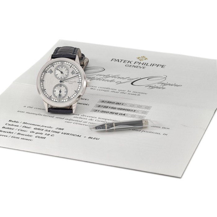 Patek Philippe. A fine and rare 18K white gold automatic annual calendar wristwatch with regulator-style dial and original certificate Signed Patek Philippe, Genève, ref. 5235G-001, movement no. 5'728'186, case no. 4'690'033, circa 2015