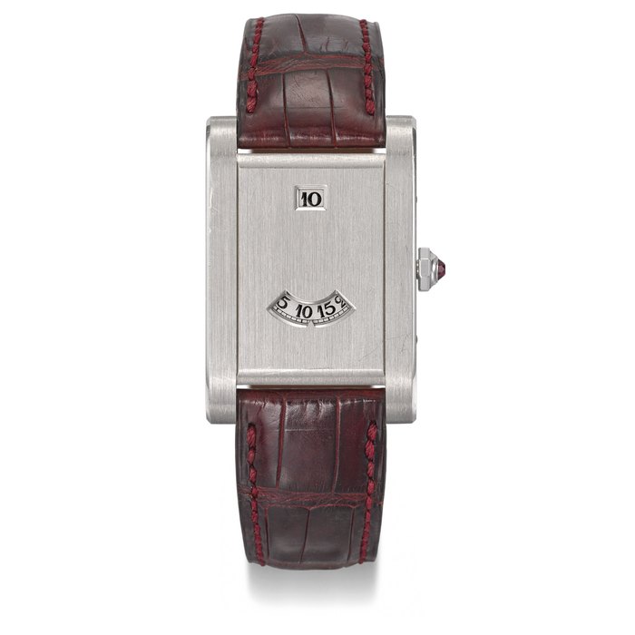 CARTIER. A VERY FINE AND RARE PLATINUM LIMITED EDITION JUMP HOUR WRISTWATCH, MADE TO COMMEMORATE THE 150TH ANNIVERSARY OF CARTIER Signed Cartier, Paris, Tank à Guichet, No. 111/150, Case No. A114470, Circa 1997